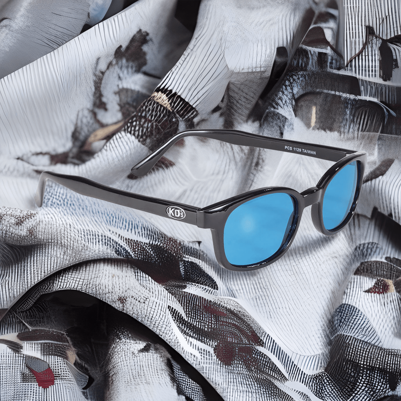 Lunettes de soleil X-KD's 1129 monture noire et verres turquoise