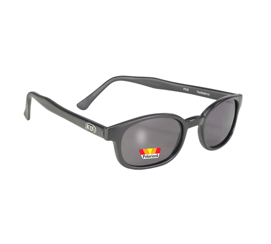 Occhiali da sole 10019 di X-KD con montatura nera opaca e lenti polarizzate grigie.